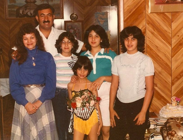 Maysoon with her family in 1984. She says, "Gotta love the feathers and paneling and my sister's upside-down-glasses."