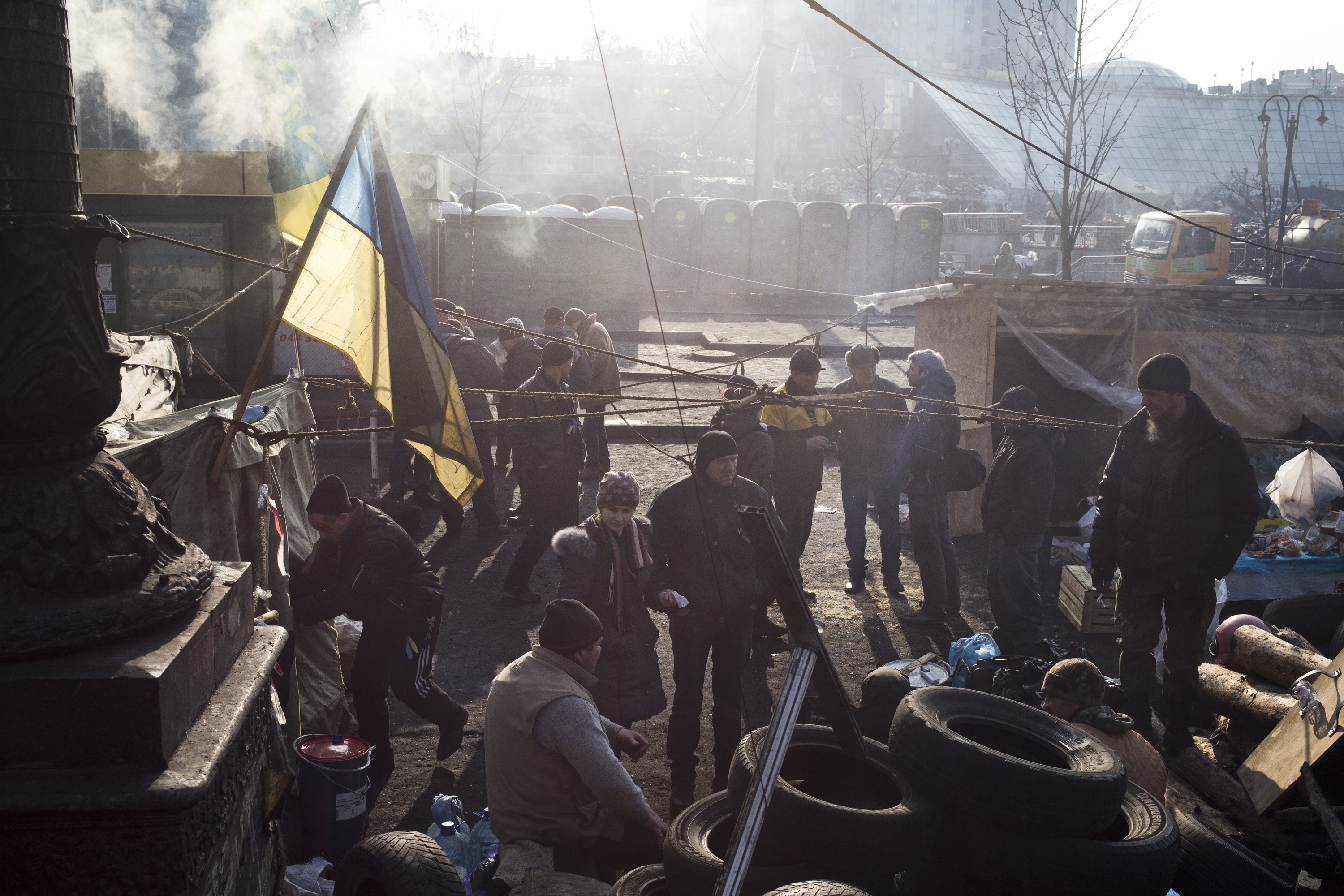 Anti-government protesters stand near barricades and tents during a sit-in of Independence Square in Kiev, Ukraine on Feb. 24, 2014. (Ed Ou/Reportage by Getty Images)