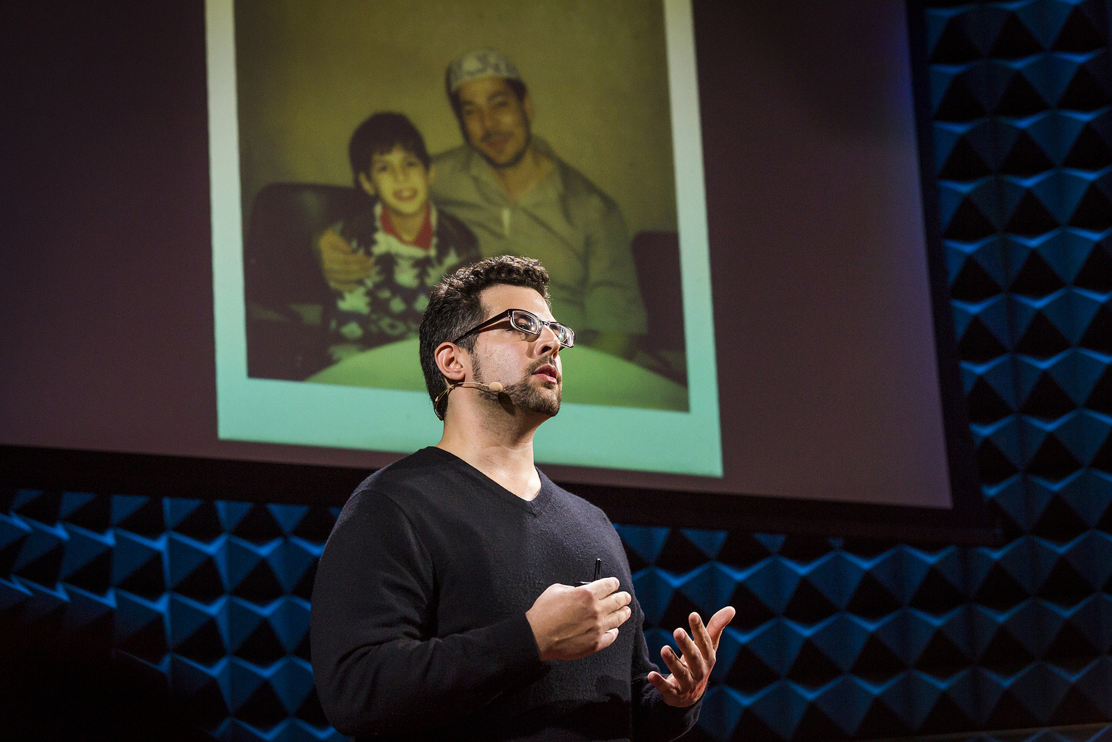 Zak Ebrahim stands before an image of him with his father. He spoke so eloquently at our audition event in New York City that we invited him to speak at the main TED conference. Photo: Ryan Lash