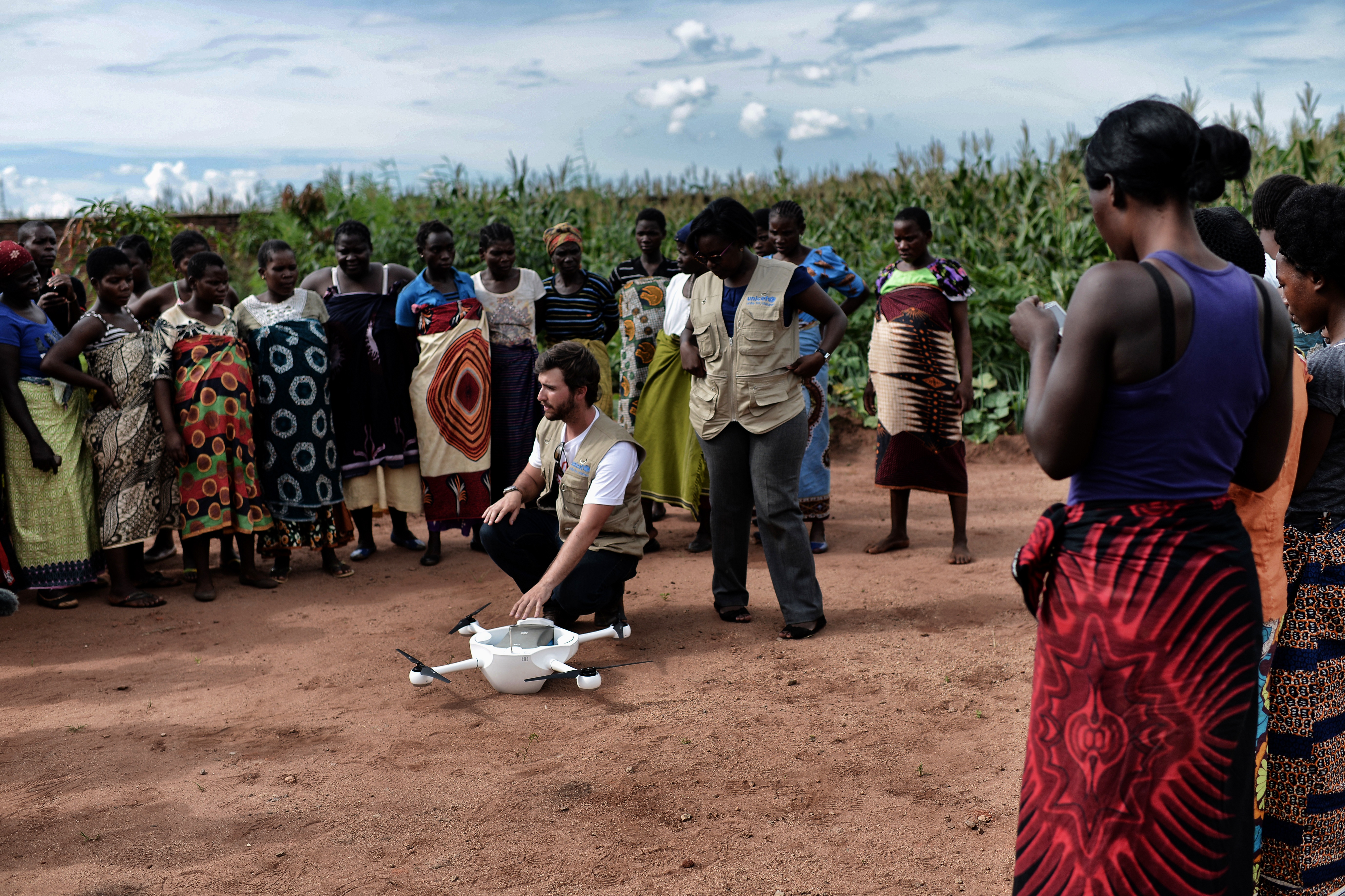 At Kamuzu Central Hospital, UAV technician Brandon Landry speaks to a group of moms-to-be, showing how the drone works and what it will be carrying: HIV tests for infants.